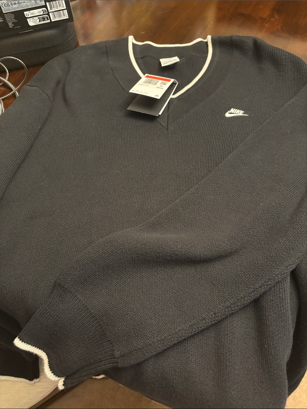 Nike Men's Black V-Neck Sweater with White Trim Accent